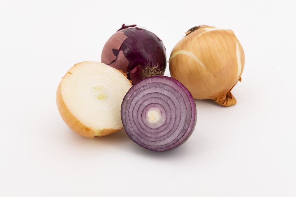 white and red halved onions