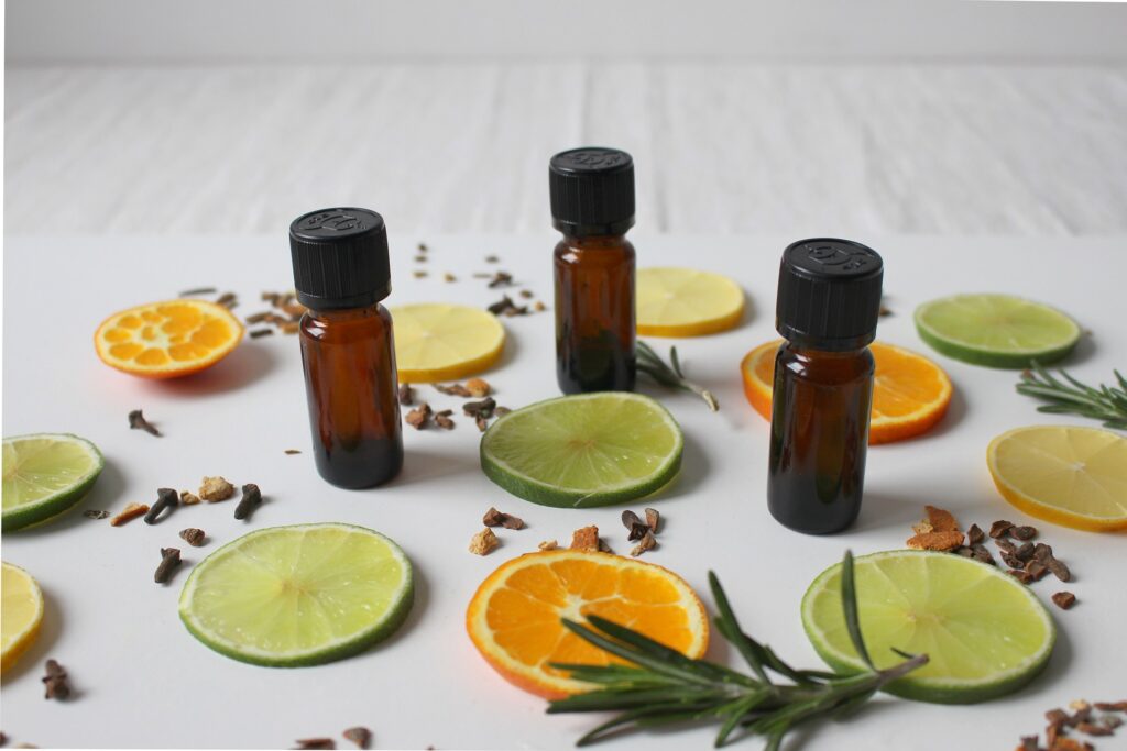 aroma oils with spices and lemon and lime slices